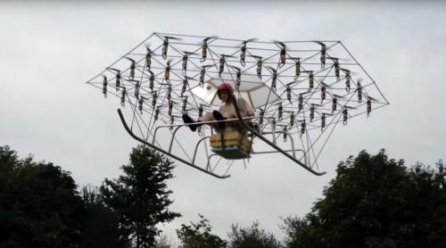 Cum să faci singur un elicopter din 54 de drone și un scaun de grădină cu umbrelă! (VIDEO)